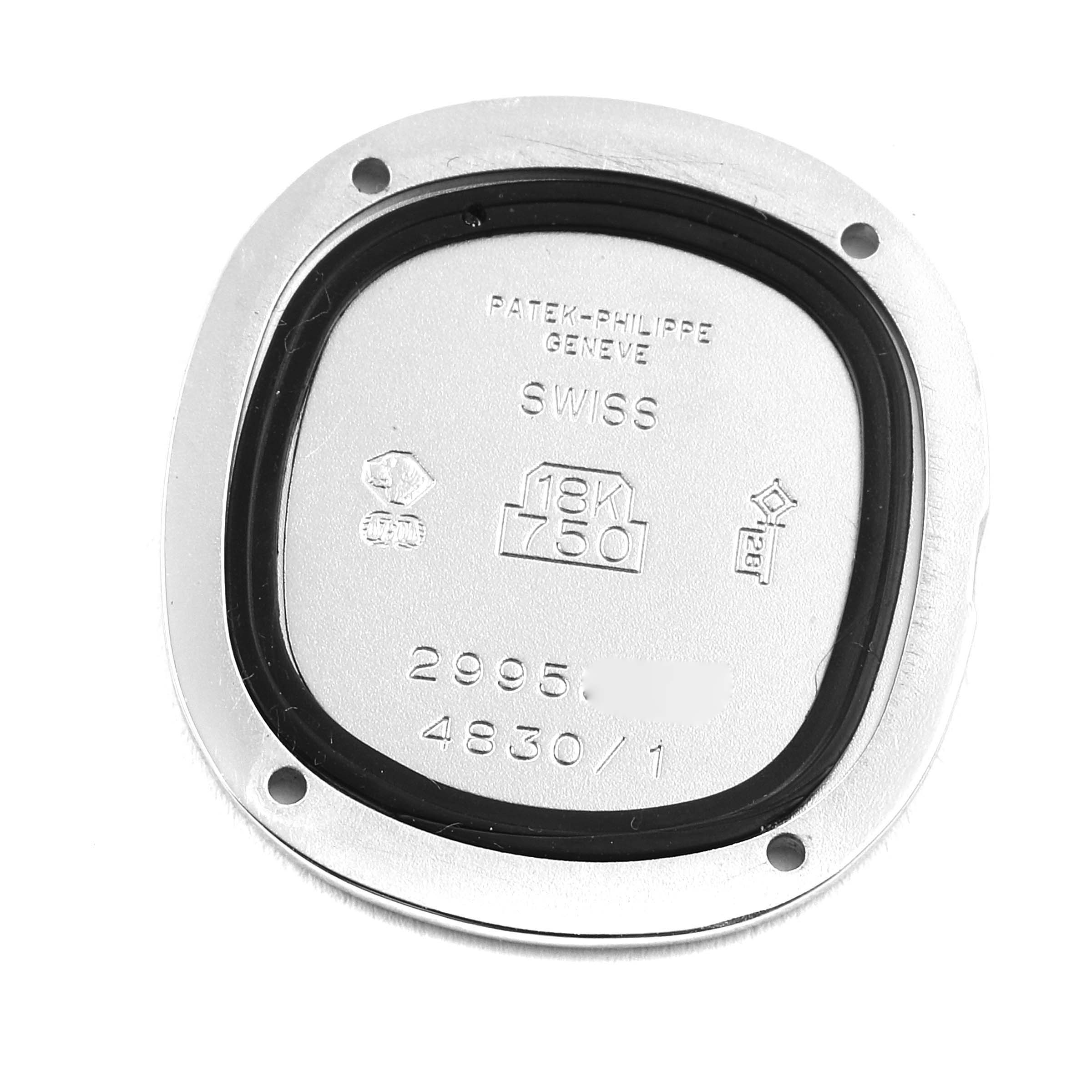 The image shows the back casing of a Patek Philippe Golden Ellipse 4830G Women's White Gold White Dial 4830G Women's White Gold White Dial watch, featuring engravings and hallmarks.