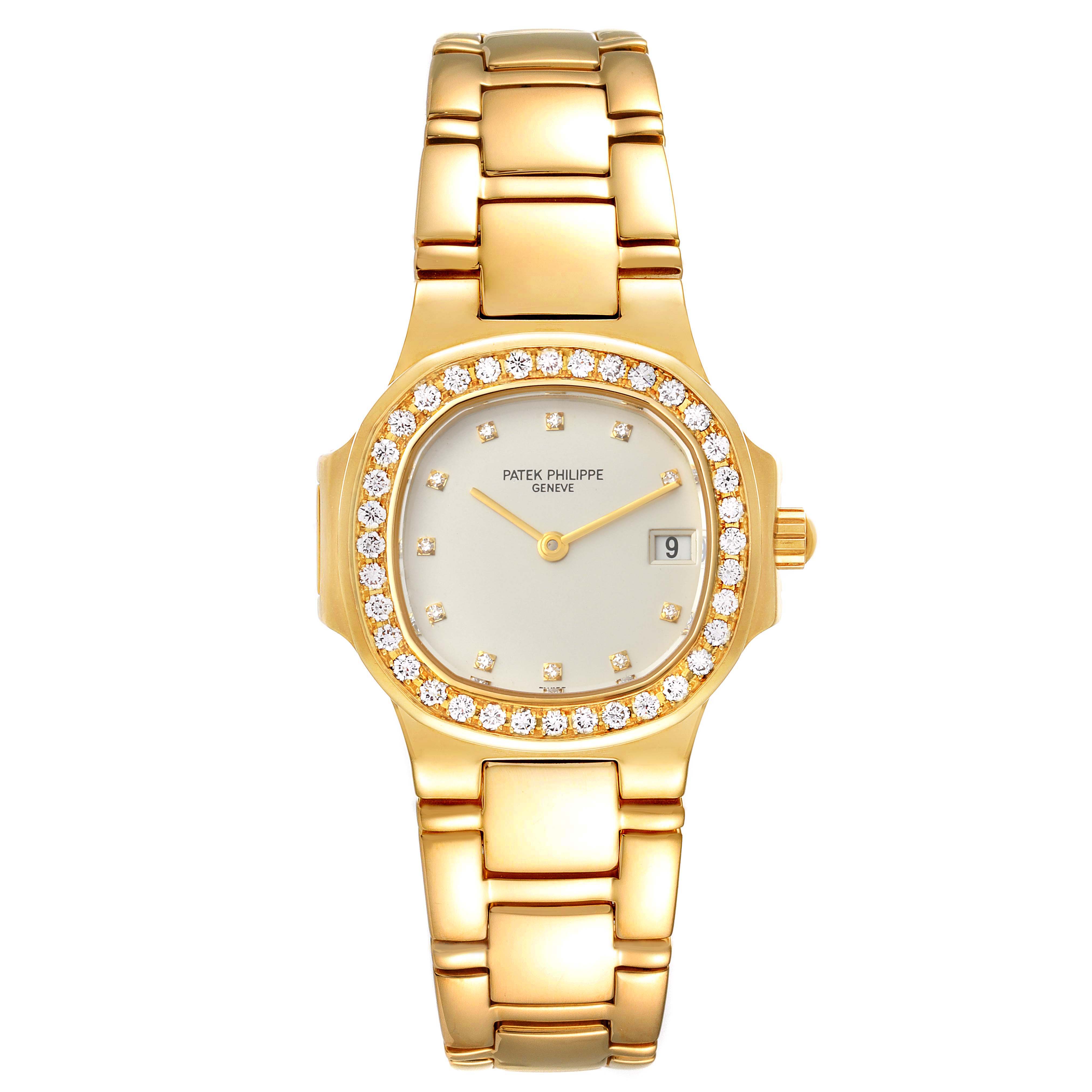 This image shows a front view of a gold Patek Philippe Nautilus 4700/530 Women's Yellow Gold Beige Dial 4700/530 Women's Yellow Gold Beige Dial watch, displaying its diamond-studded bezel, dial, and bracelet.
