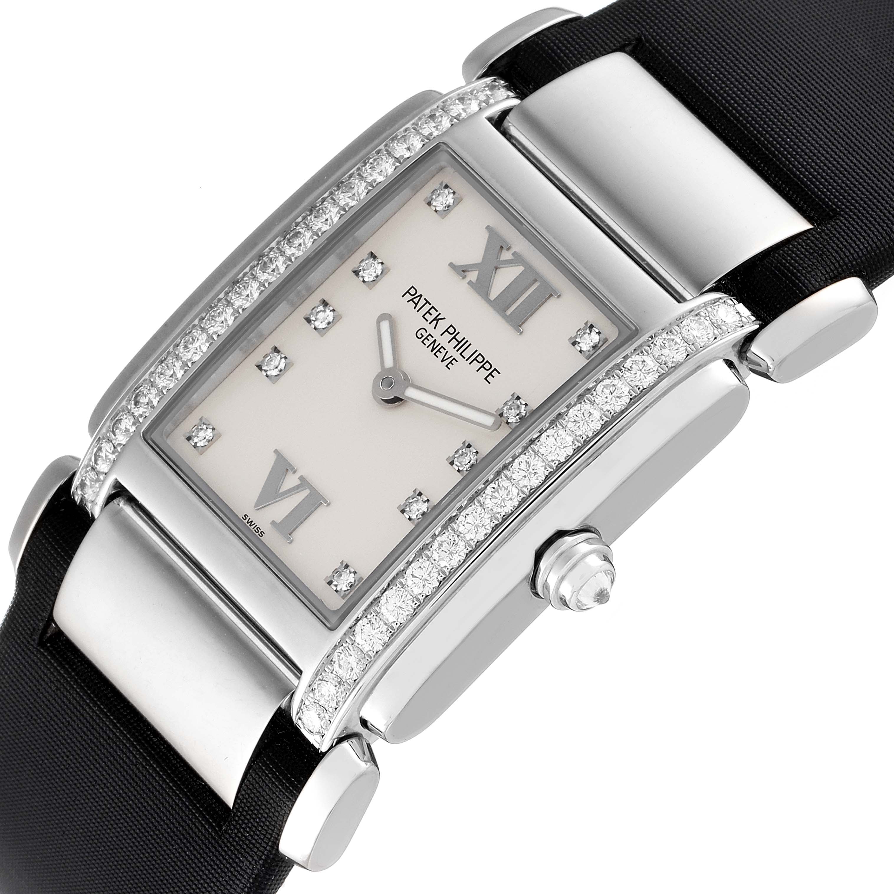 The image shows a Patek Philippe Twenty-4 4920G-010 Women's White Gold Silver Dial 4920G-010 Women's White Gold Silver Dial watch angled to display the face, bezel, crown, and part of the strap.