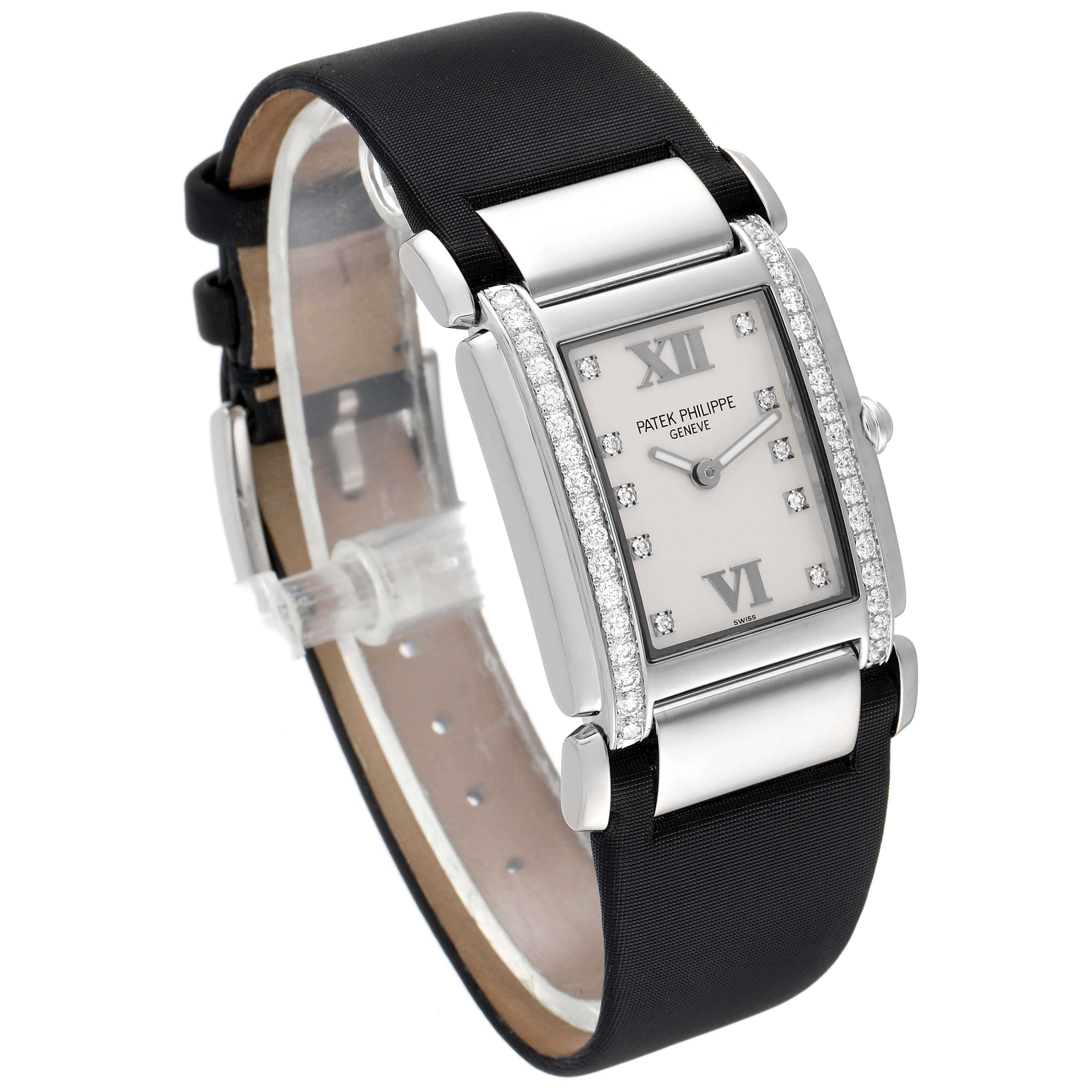 This Patek Philippe Twenty-4 4920G-010 Women's White Gold Silver Dial 4920G-010 Women's White Gold Silver Dial watch is shown at an angle highlighting the face, bezel, and strap.