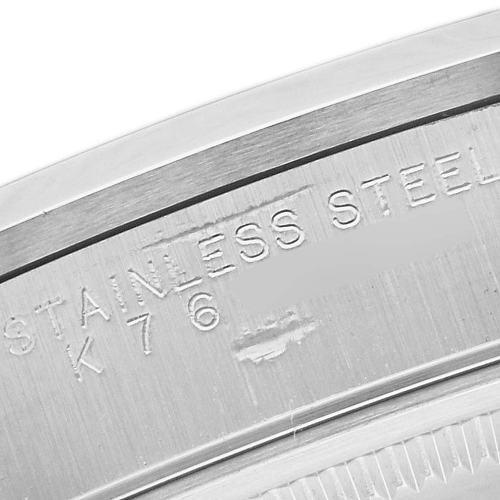 The image shows a close-up of the casing edge of a Rolex Air-King 14000 Men's Stainless Steel Black Dial 14000 Men's Stainless Steel Black Dial watch, revealing the engraved text "STAINLESS STEEL."