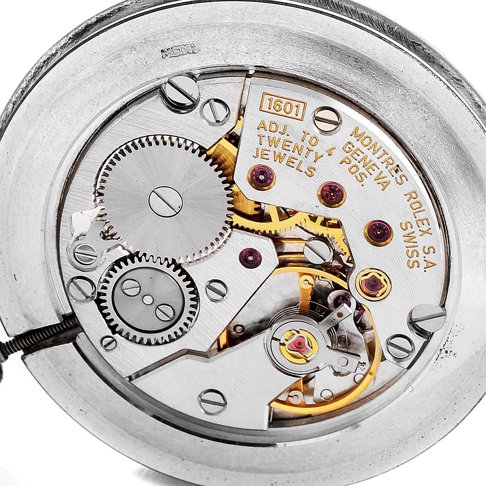 This image shows the intricate internal movement of the Rolex Cellini 4112 Men's Yellow Gold Champagne Dial 4112 Men's Yellow Gold Champagne Dial model, revealing gears, jewels, and engravings.