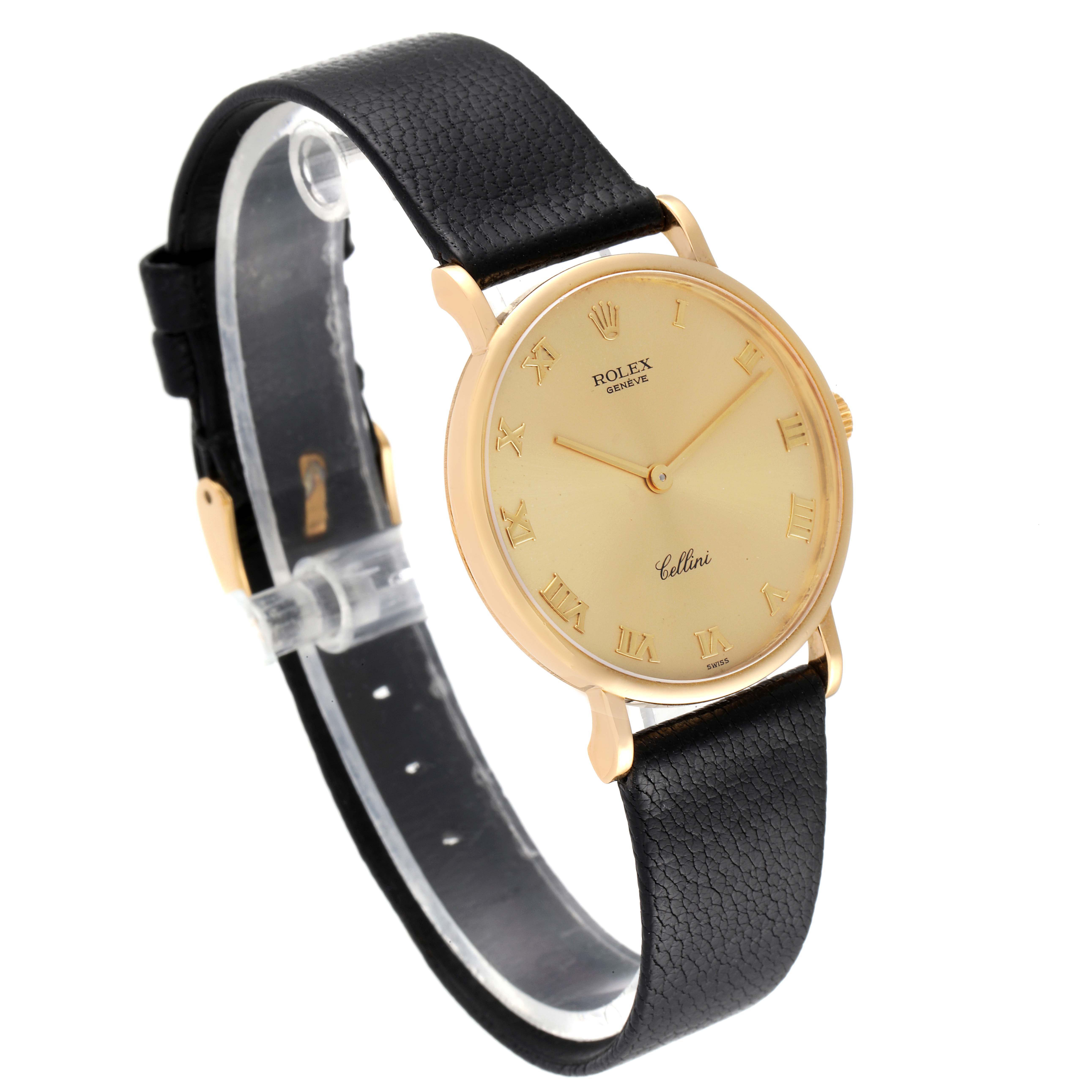 The Rolex Cellini 5112 Men's Yellow Gold Champagne Dial 5112 Men's Yellow Gold Champagne Dial watch is shown from a front angle, highlighting its black leather strap and gold case with Roman numeral markers.