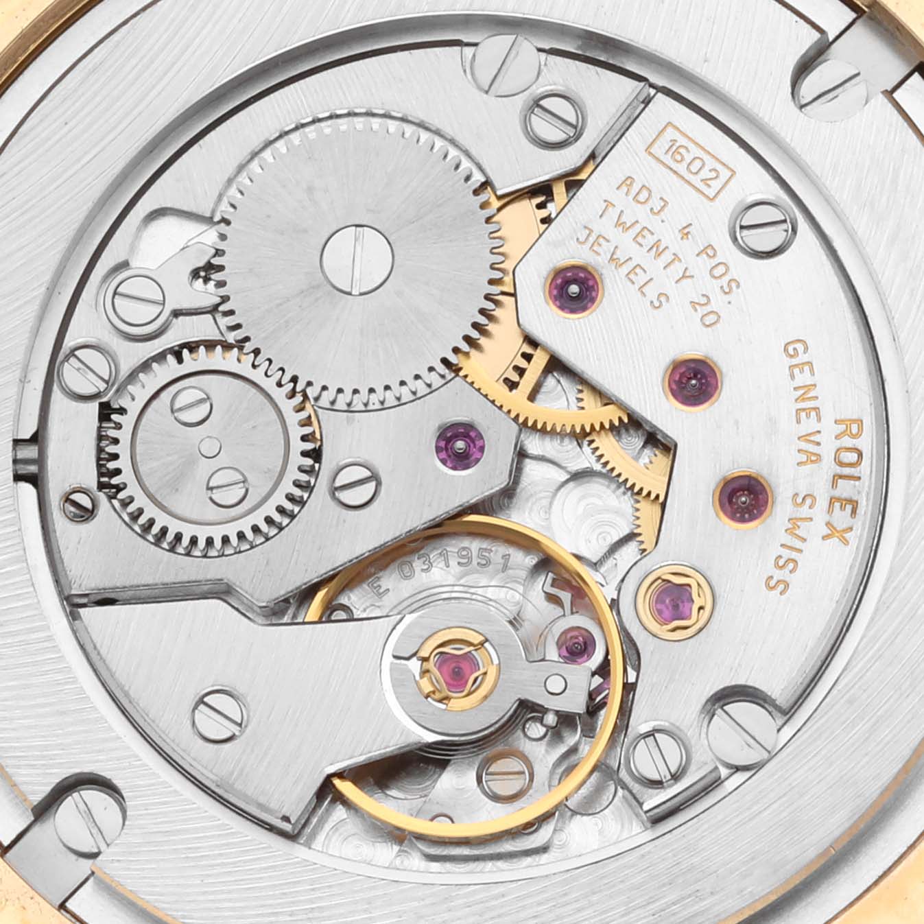 The image shows the movement of a Rolex Cellini 5116/8 Men
s Yellow Gold Beige Dial 5116/8 Men
s Yellow Gold Beige Dial watch from a top-down angle, highlighting its gears and intricate components.