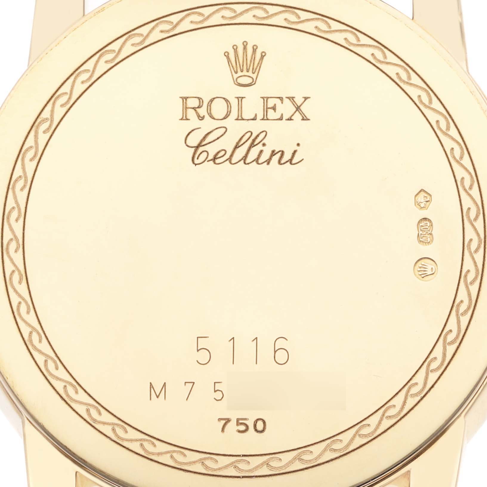The image shows the back case of a Rolex Cellini 5116/8 Men
s Yellow Gold Beige Dial 5116/8 Men
s Yellow Gold Beige Dial watch with engraved details and branding.