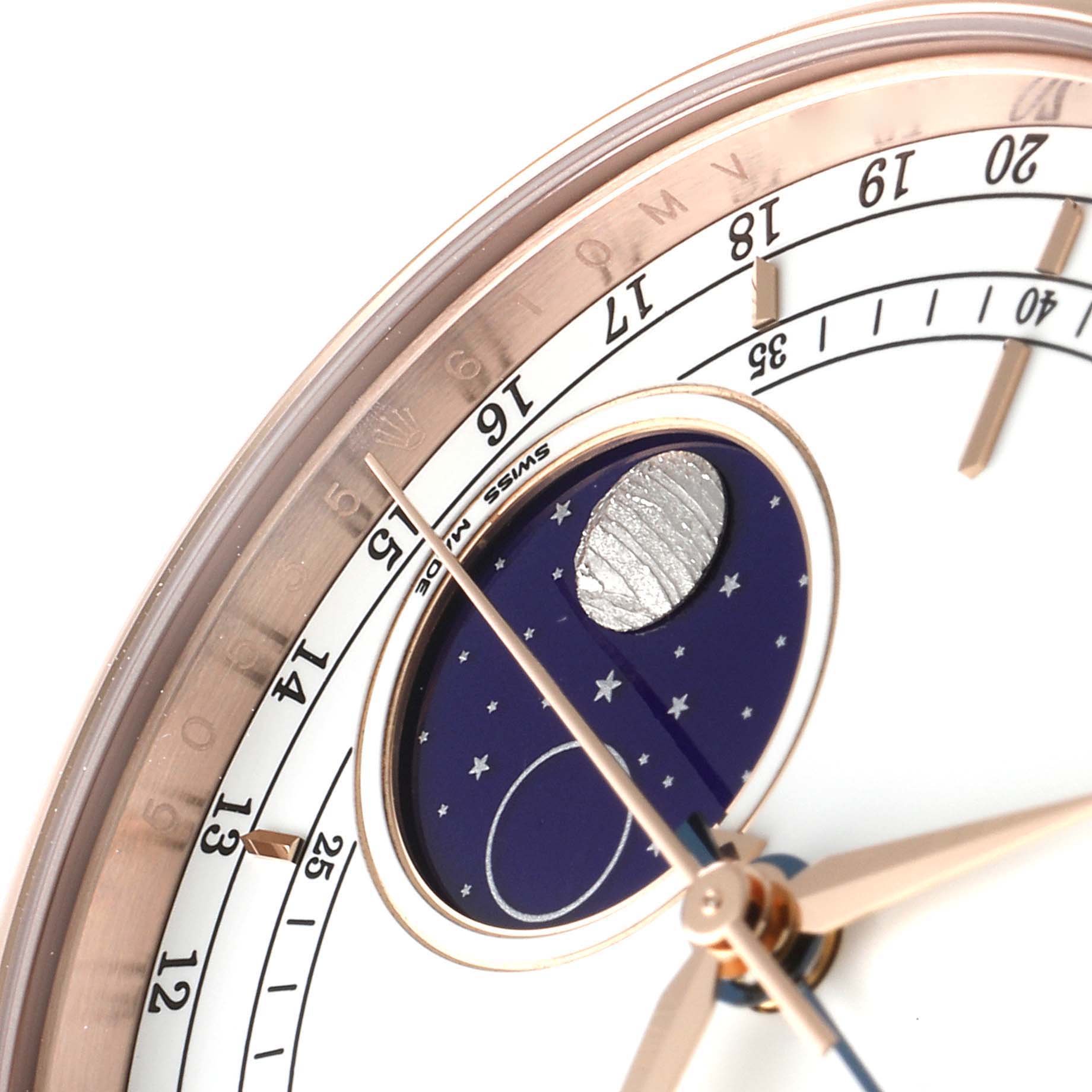 The image displays a close-up of the face of a Rolex Cellini 50535 Men
s Rose Gold White Dial 50535 Men
s Rose Gold White Dial watch, focusing on the moon phase and the hour hand.