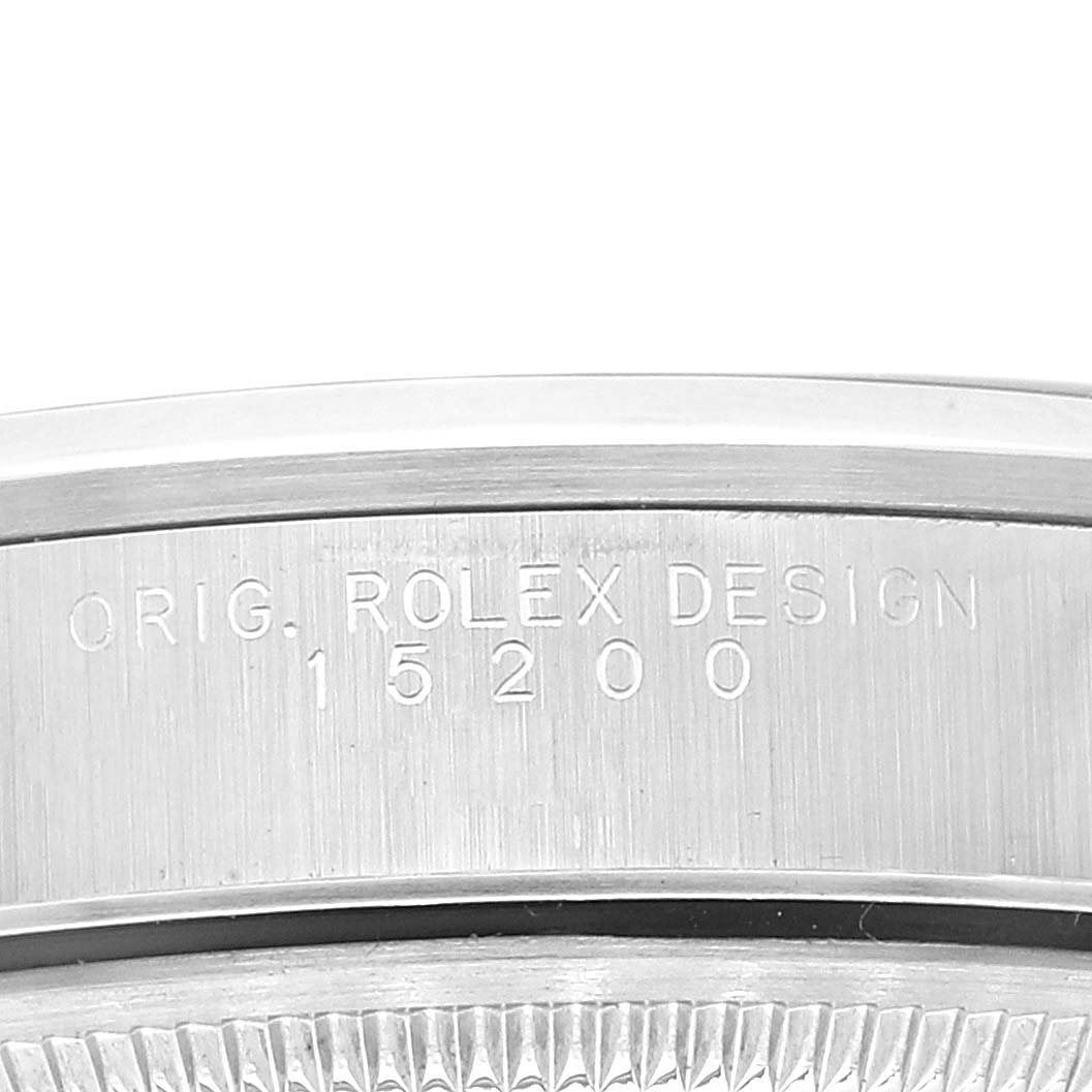 The image shows a close-up view of the engraved details and bezel of a Rolex Date 15200 Men
s Stainless Steel Black Dial 15200 Men
s Stainless Steel Black Dial model, displaying the design code 15200.