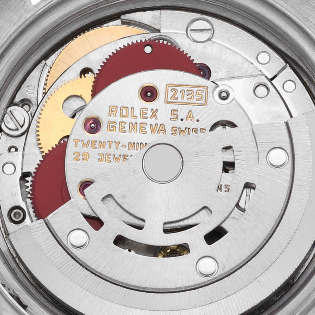 The image shows the inner mechanical movement of a Rolex Datejust 69174 Women's Stainless Steel Silver Dial 69174 Women's Stainless Steel Silver Dial watch, highlighting gears and inscriptions from a direct overhead angle.