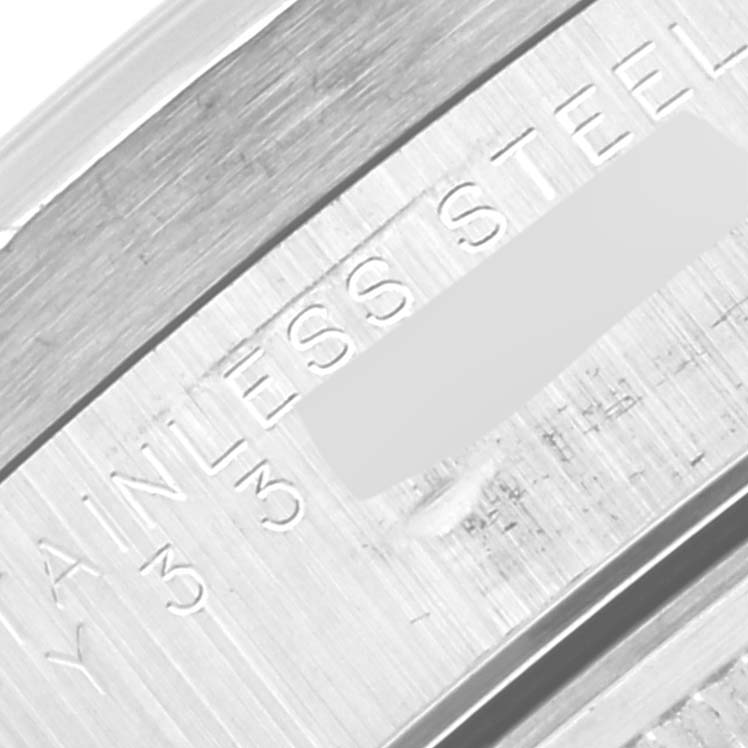 The image shows a close-up of the stainless steel engraving on the case of the Rolex Date 15210 Men's Stainless Steel White Dial 15210 Men's Stainless Steel White Dial model watch.