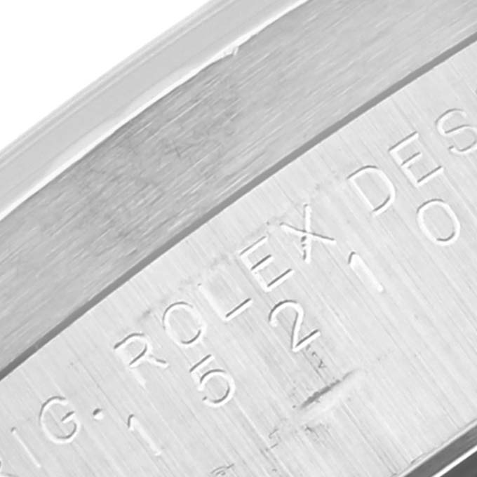 This close-up shows the engraved text on the side of the bezel of a Rolex Date 15210 Men's Stainless Steel White Dial 15210 Men's Stainless Steel White Dial model watch.