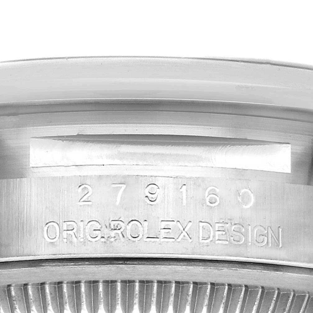 The image shows a close-up of the side of a Rolex Datejust 279160 Women's Stainless Steel Pink Dial 279160 Women's Stainless Steel Pink Dial, featuring the model number and "ORIG ROLEX DESIGN" engraving.