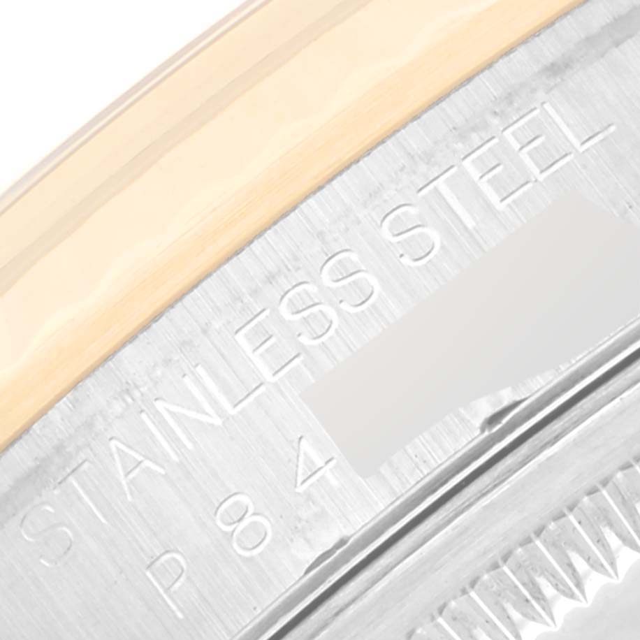 This close-up image shows the stainless steel and possibly gold bezel of a Rolex Datejust 16233 Men's Steel and Gold (two tone) Black Dial 16233 Men's Steel and Gold (two tone) Black Dial watch.