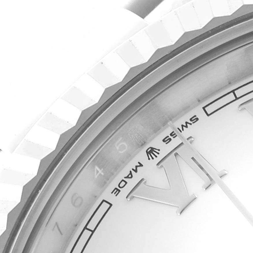 The image shows a close-up of the bezel and partial face of a Rolex Datejust 41 126334 Men's Stainless Steel White Dial 126334 Men's Stainless Steel White Dial watch, highlighting the "SWISS MADE" text and markers.