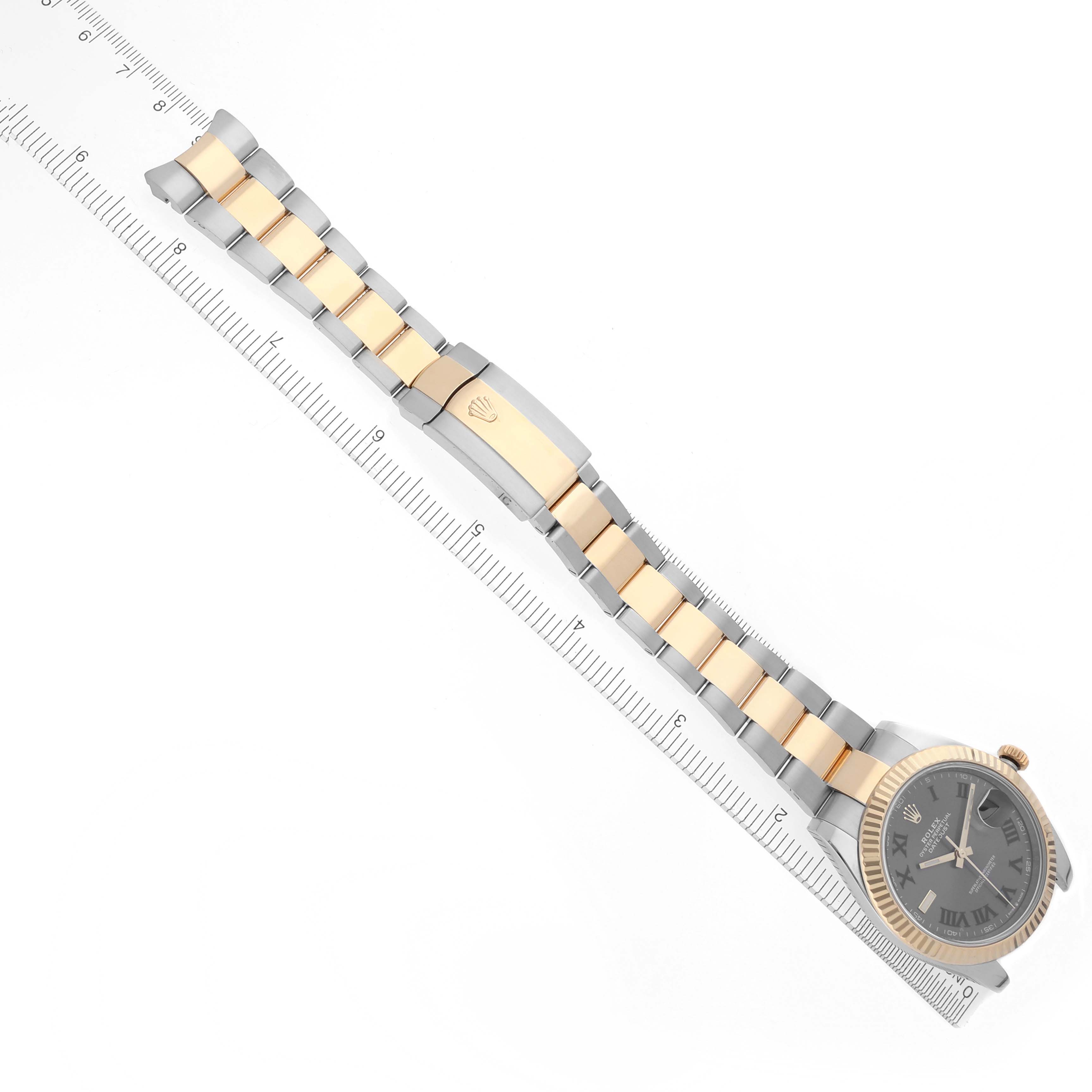The Rolex Datejust 41 126333 Men's Steel and Gold (two tone) Grey Dial 126333 Men's Steel and Gold (two tone) Grey Dial watch is shown from a top-down angle, displaying the full bracelet, clasp, and face alongside a ruler for scale.