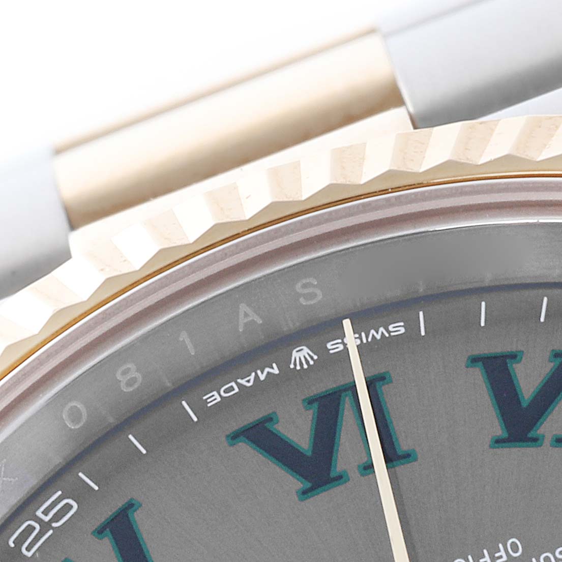 The image shows a close-up of the Rolex Datejust 41 126333 Men's Steel and Gold (two tone) Grey Dial 126333 Men's Steel and Gold (two tone) Grey Dial, highlighting the bezel, part of the bracelet, and dial with Roman numerals.