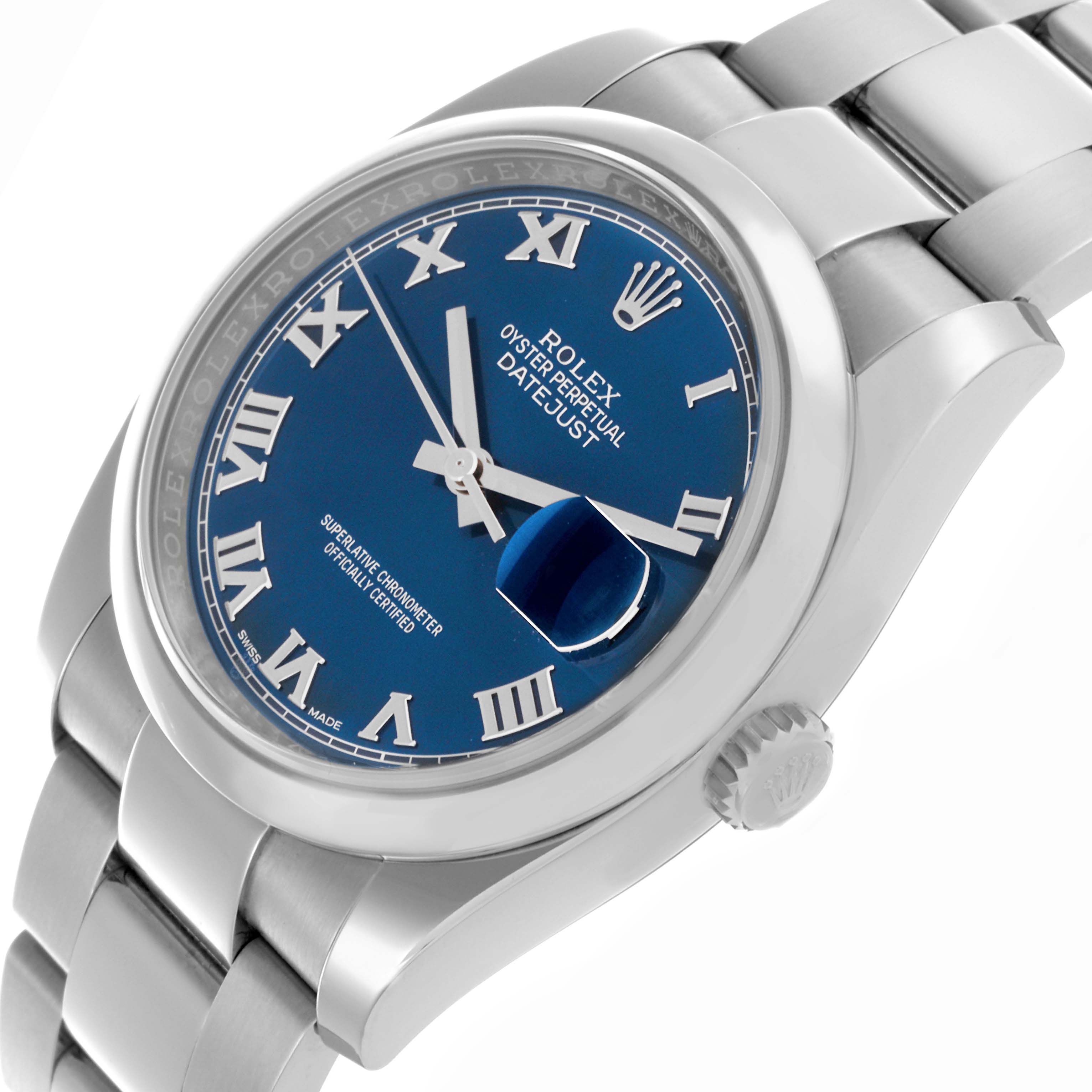 The image shows a Rolex Datejust 116200 Men's Stainless Steel Blue Dial 116200 Men's Stainless Steel Blue Dial watch from a tilted side angle, highlighting the blue dial, Roman numerals, and stainless steel bracelet.