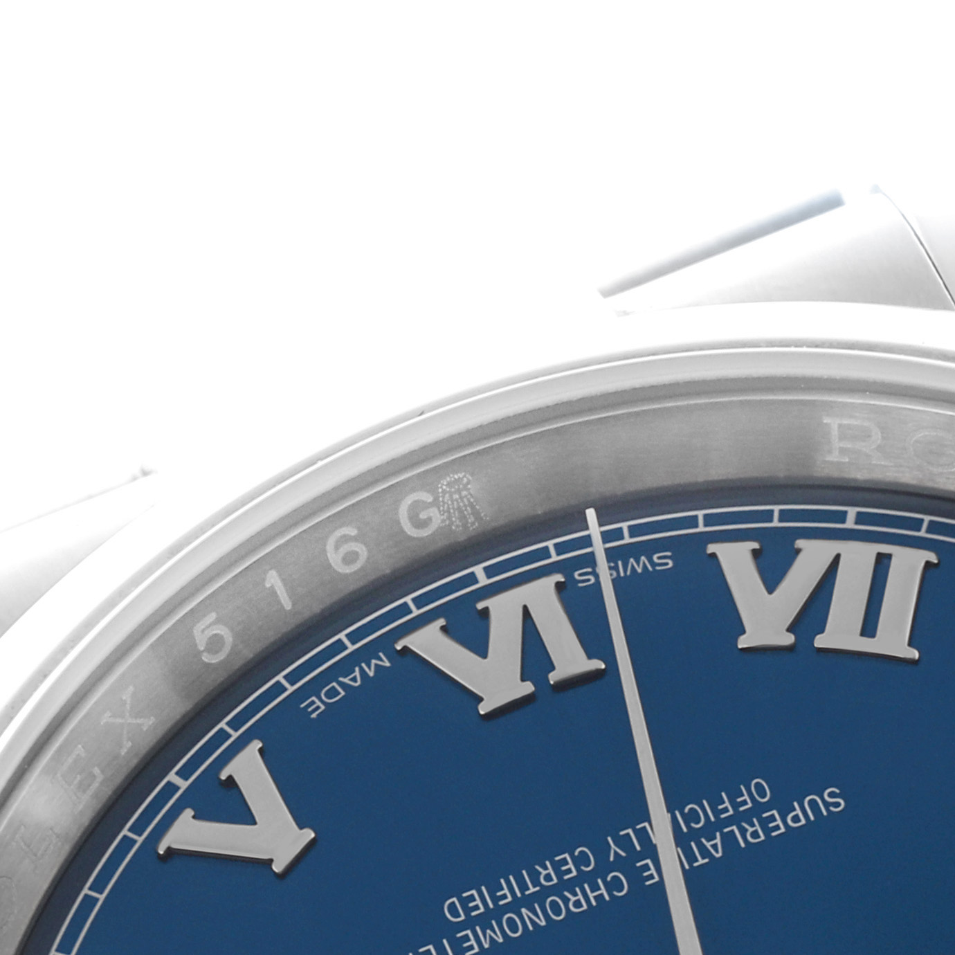 The image shows a close-up of the Rolex Datejust 116200 Men's Stainless Steel Blue Dial 116200 Men's Stainless Steel Blue Dial watch face, focusing on the bezel, Roman numerals, and part of the dial.
