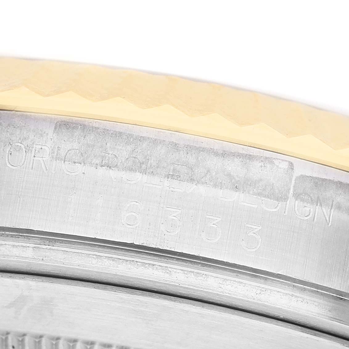 The image shows a close-up of the side of the Rolex Datejust 41 116333 Men's Steel and Gold (two tone) Champagne Dial, highlighting the engravings and bezel edge.