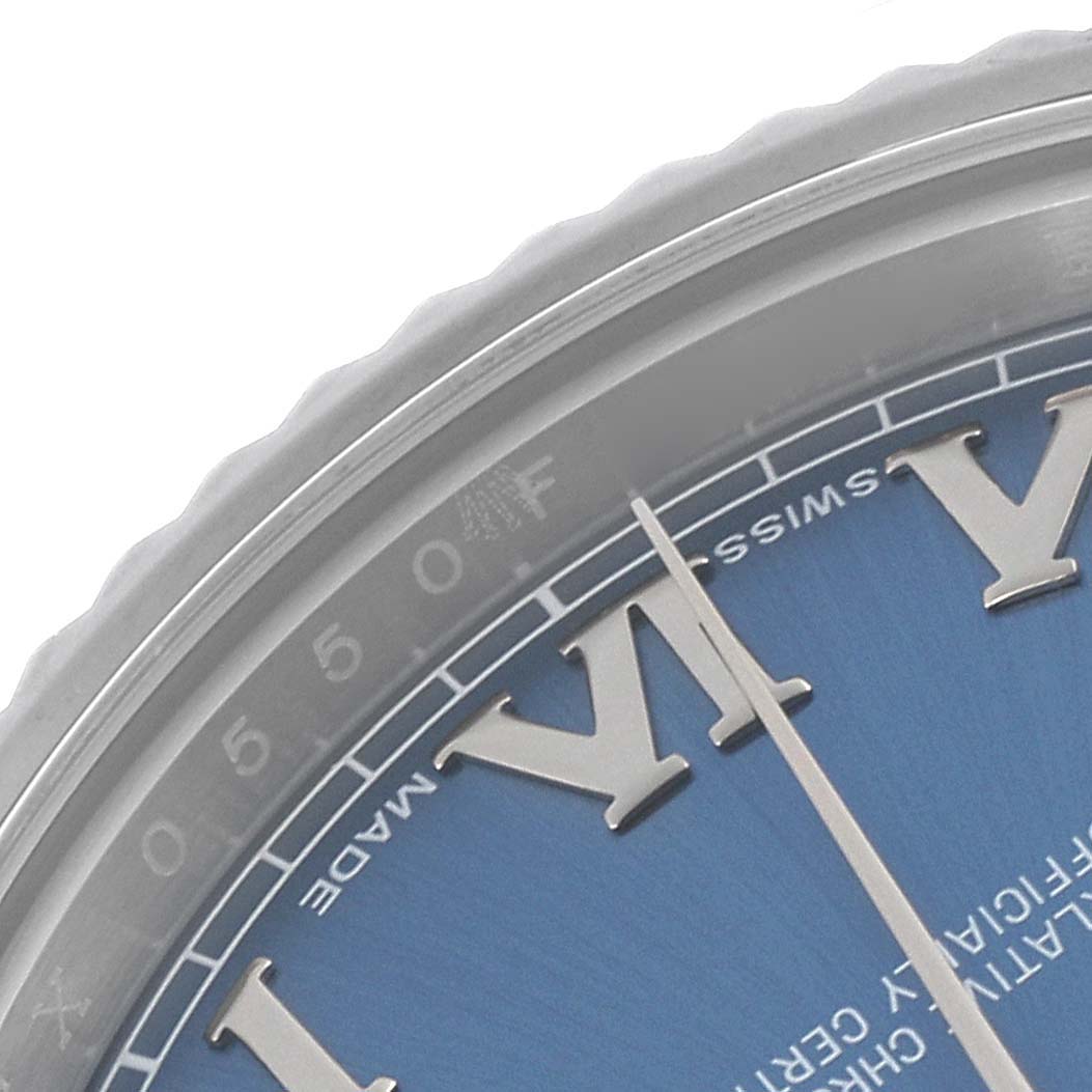 The image shows a close-up of the dial
s edge on a Rolex Datejust 41 116334 Men
s Stainless Steel Blue Dial 116334 Men
s Stainless Steel Blue Dial, focusing on the roman numeral markers and part of the bezel.
