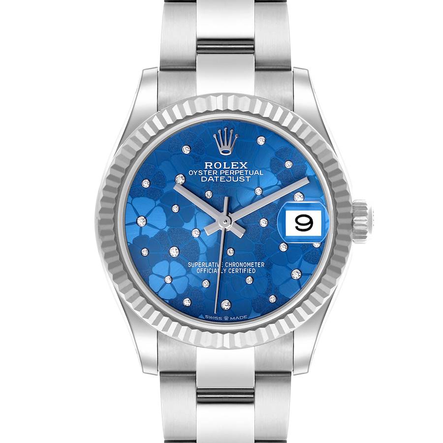 The Rolex Mid-Size model is shown from a front angle, highlighting its blue dial, date display, and fluted bezel.