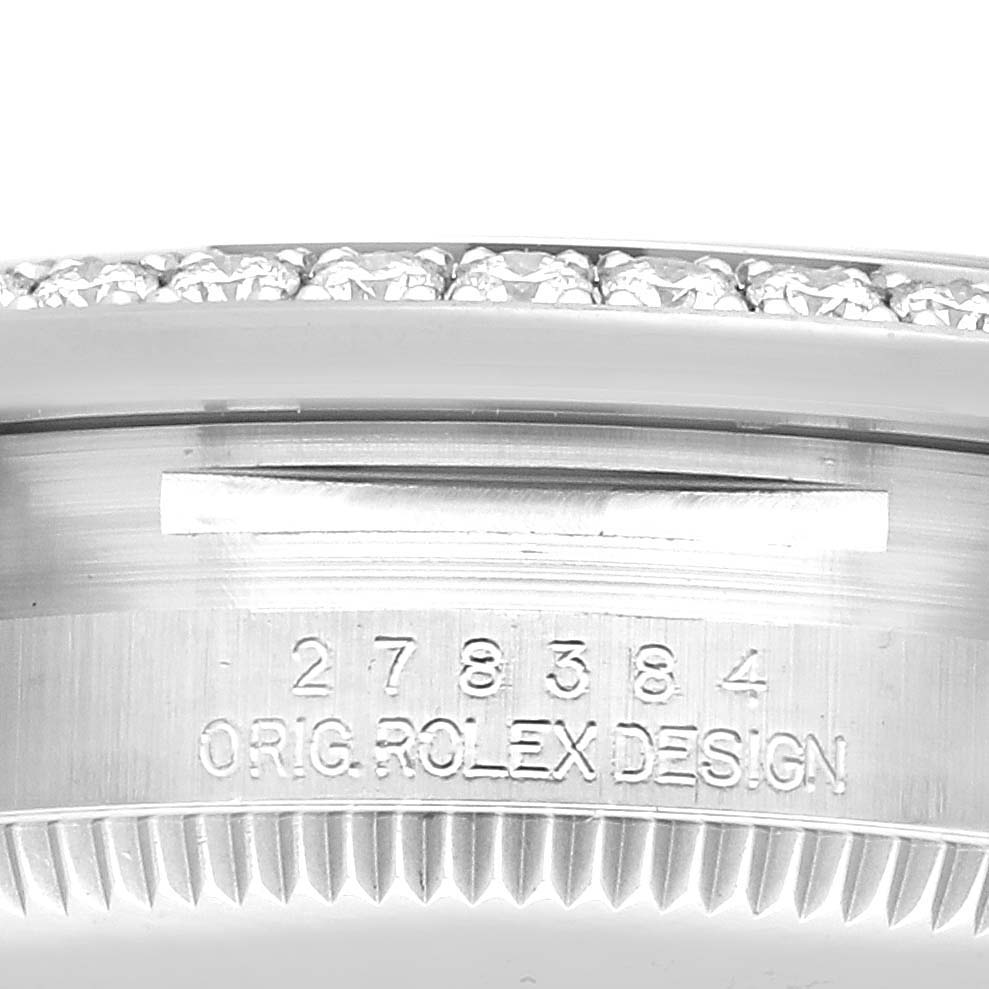 The image shows the side of a Rolex Mid-Size 278384RBR Women's Stainless Steel Green Dial 278384RBR Women's Stainless Steel Green Dial watch, highlighting the bezel and bracelet with the engraving "ORIG. ROLEX DESIGN."