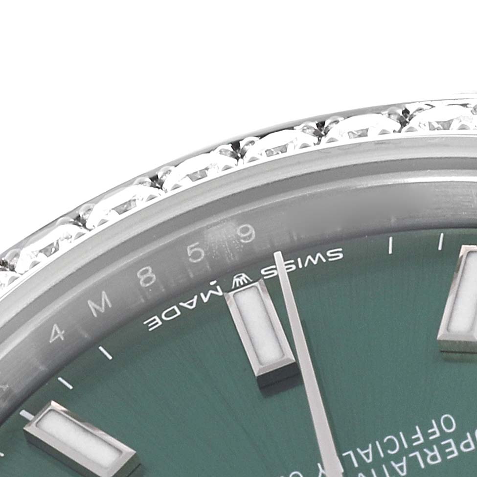 This close-up image of a Rolex Mid-Size 278384RBR Women's Stainless Steel Green Dial 278384RBR Women's Stainless Steel Green Dial watch shows the dial, markers, and jeweled bezel, viewed from an angled top perspective.