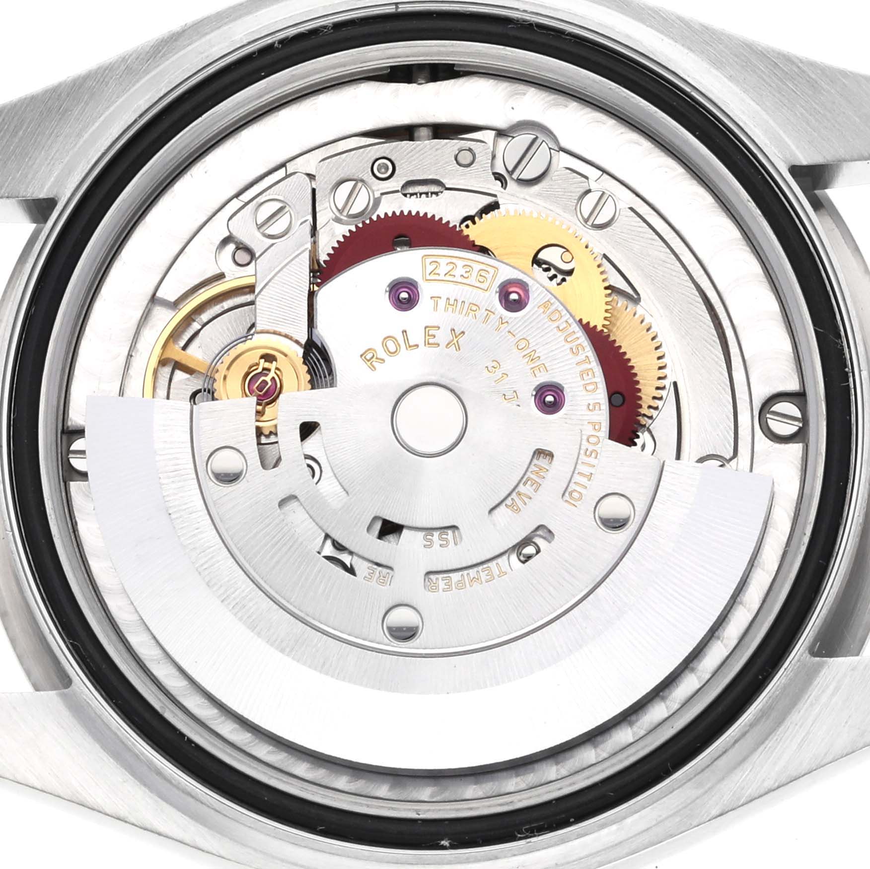 The image shows the movement mechanism of a Rolex Mid-Size 278384RBR Women's Stainless Steel Green Dial 278384RBR Women's Stainless Steel Green Dial model viewed from the back, highlighting gears and components.