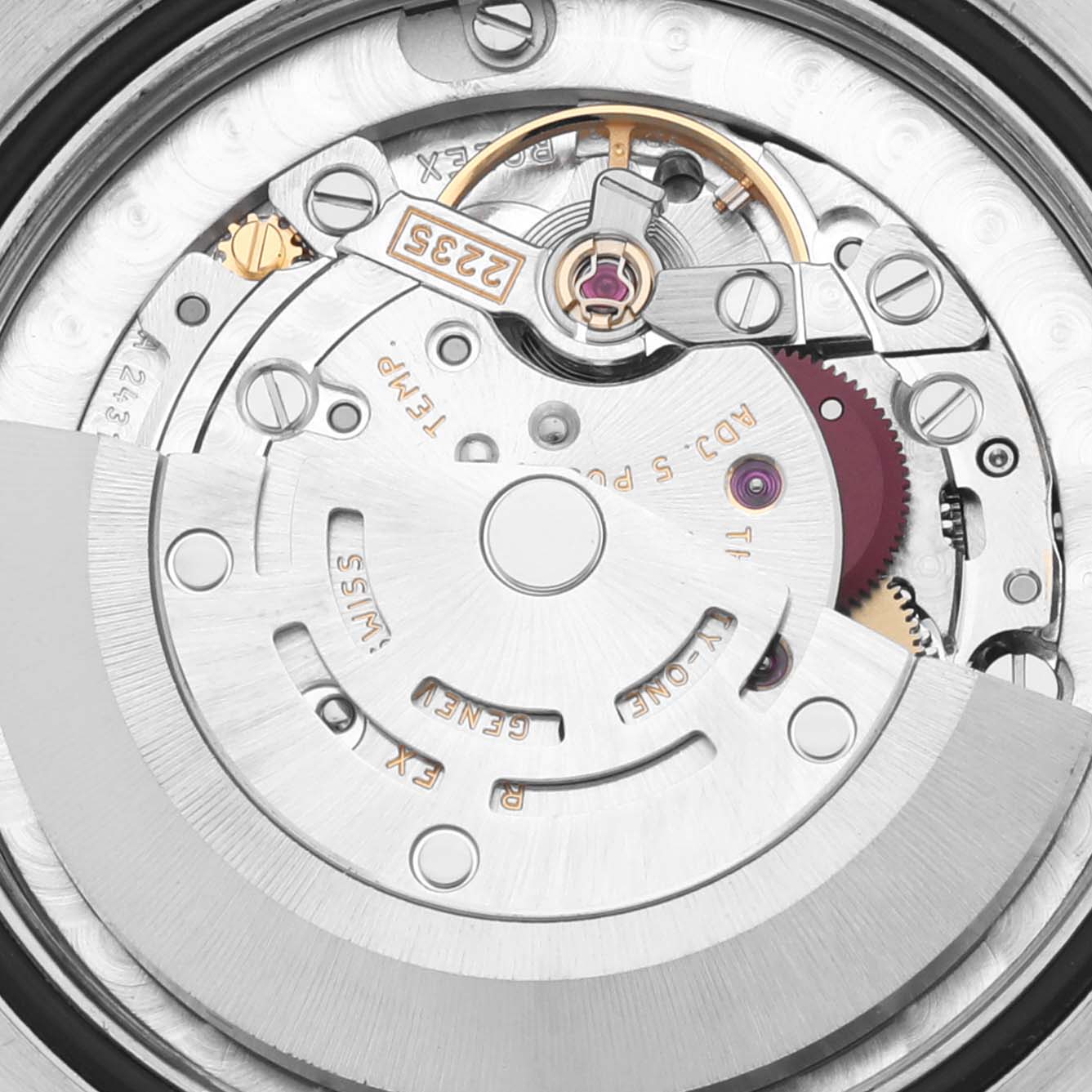The image shows the movement mechanism of a Rolex Mid-Size 178274 Women's Stainless Steel Mother of Pearl Dial 178274 Women's Stainless Steel Mother of Pearl Dial watch, highlighting the rotor, balance wheel, and gears.
