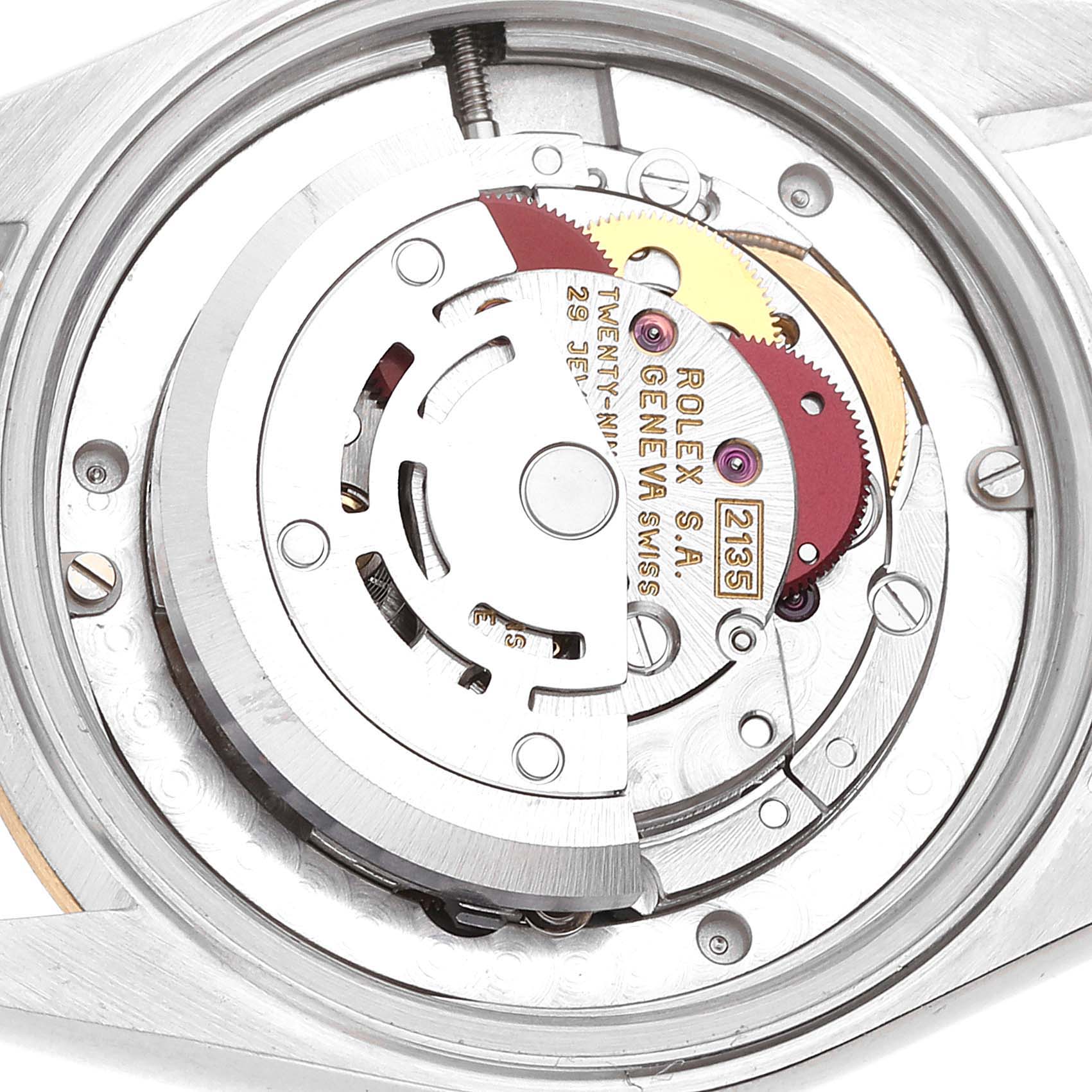 This image shows the intricate internal movement and mechanisms of a Mid-Size Rolex watch viewed from the back.
