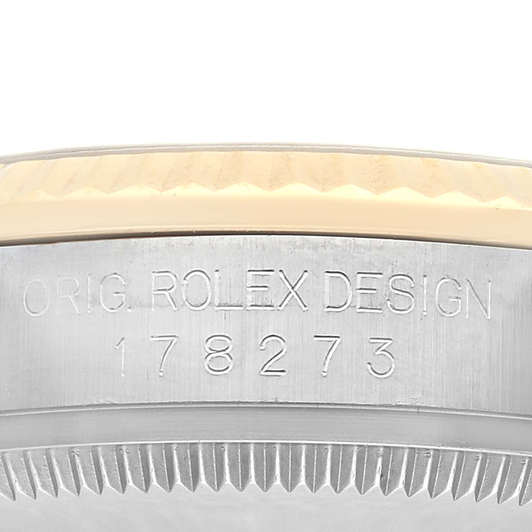 The image shows a close-up of the side of a mid-size Rolex watch, including the model number and part of the bezel.