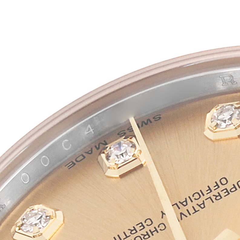 The image shows a close-up of the Rolex Mid-Size 178273 Women's Steel and Gold (two tone) Champagne Dial 178273 Women's Steel and Gold (two tone) Champagne Dial watch face, highlighting diamond hour markers and the edge of the dial.