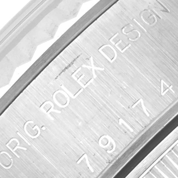The image shows a close-up of the engraving on the case of a Rolex Datejust 79174 Women's Stainless Steel Silver Dial 79174 Women's Stainless Steel Silver Dial watch, highlighting "ORIG. ROLEX DESIGN."