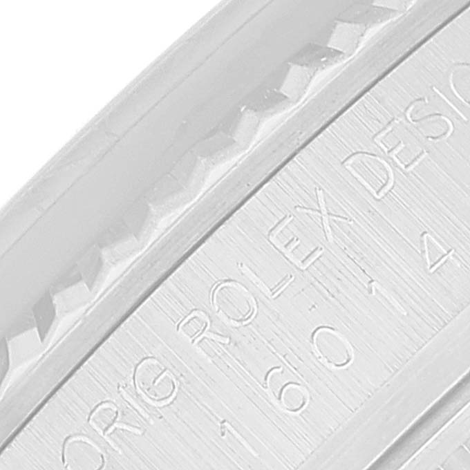 This image shows a close-up of the engraved edge of a Rolex Vintage Collection 16014 Men
s Stainless Steel Silver Dial 16014 Men
s Stainless Steel Silver Dial model watch case.