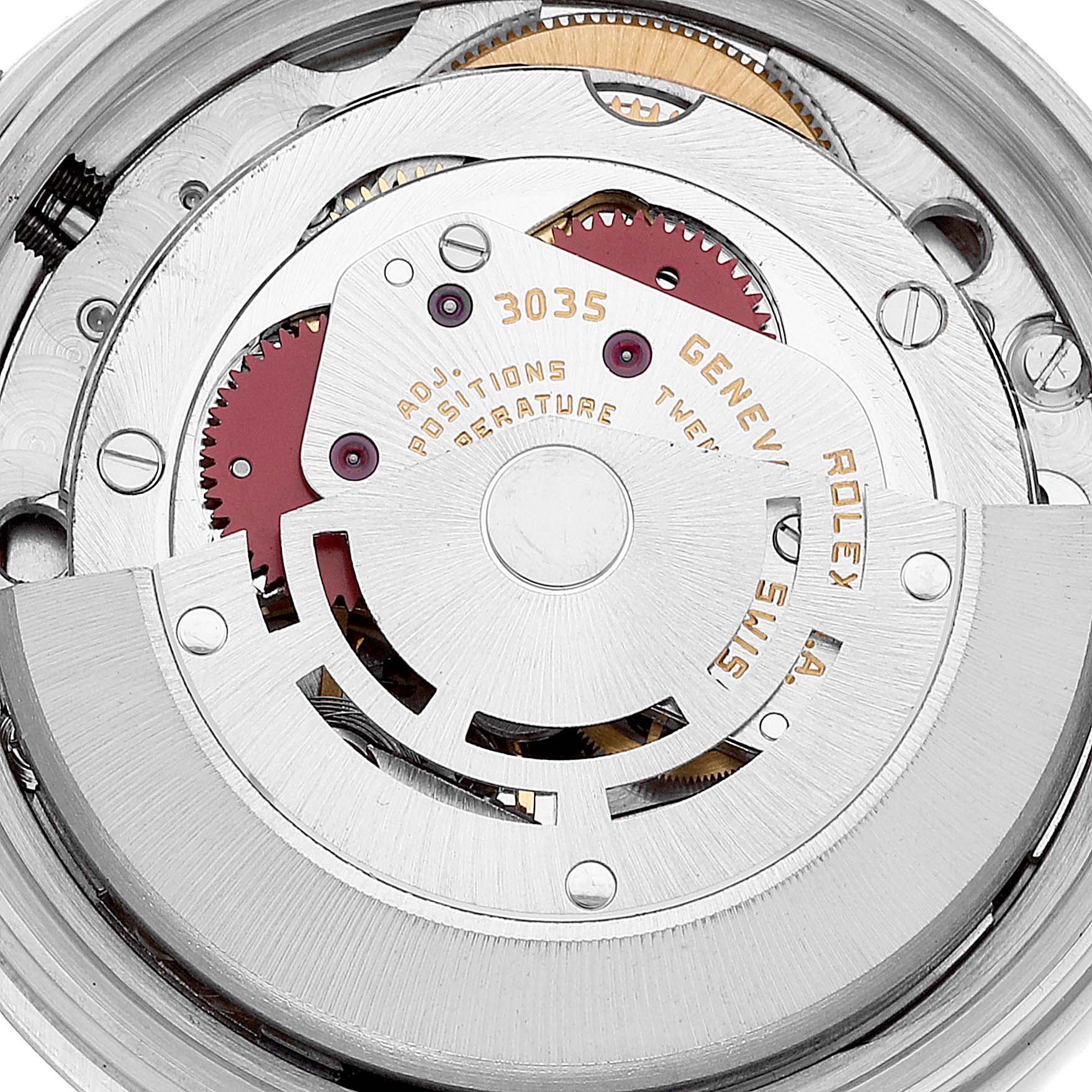 The image shows the intricate internal movement mechanism of the Vintage Collection model by Rolex, including gears and rotors.