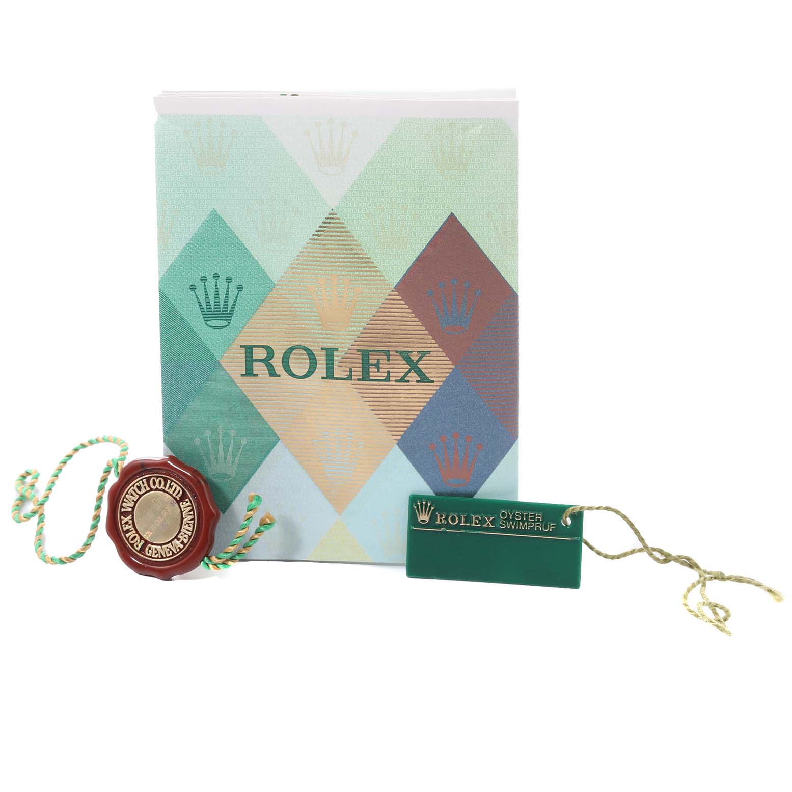 The image shows the accessories of a Rolex Datejust 79163 Women's Steel and Gold (two tone) Champagne Dial 79163 Women's Steel and Gold (two tone) Champagne Dial model, including a booklet, a green tag, and a red seal.