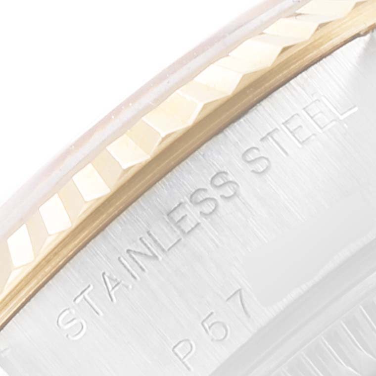 This macro shot of a Rolex Datejust 79173 Women
s Steel and Gold (two tone) Champagne Dial 79173 Women
s Steel and Gold (two tone) Champagne Dial shows the stainless steel case and part of the fluted bezel.