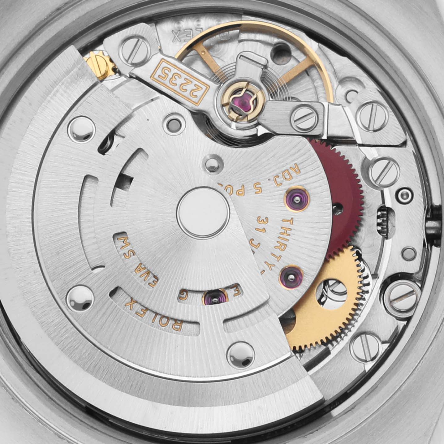 The image shows the movement of a Rolex Datejust 179173 Women
s Steel and Gold (two tone) White Dial 179173 Women
s Steel and Gold (two tone) White Dial, highlighting gears and mechanisms from a top-down angle.