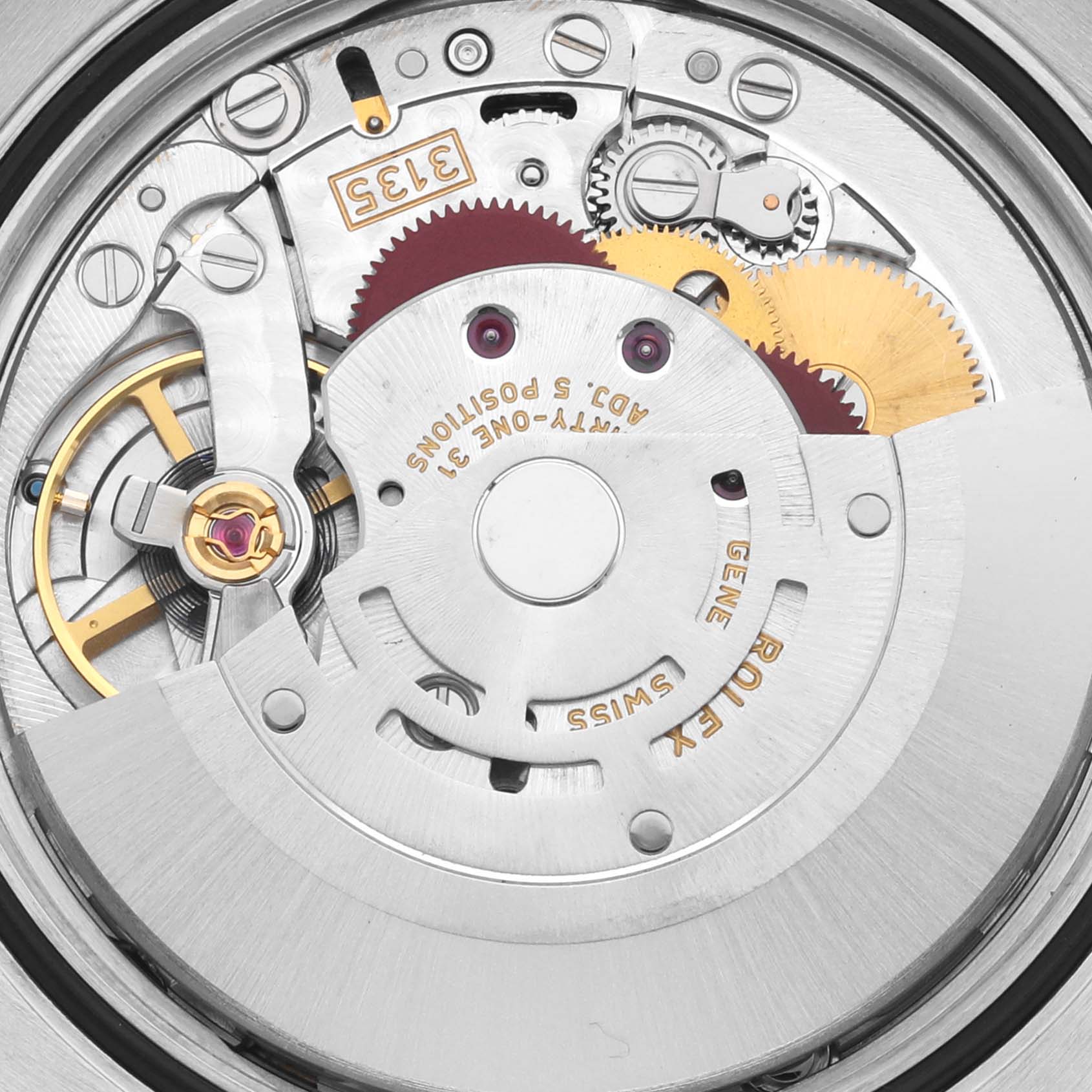 The image shows the intricate movement of a Rolex Datejust 116233 Men's Steel and Gold (two tone) White Dial 116233 Men's Steel and Gold (two tone) White Dial watch, focusing on gears and mechanical components from an overhead angle.