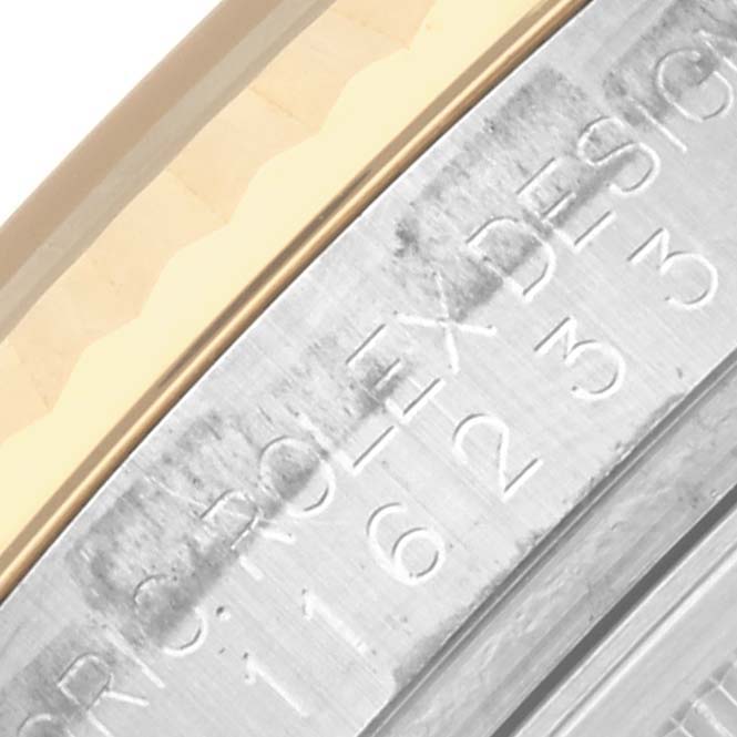 The image shows a close-up of the Rolex Datejust 116233 Men's Steel and Gold (two tone) White Dial 116233 Men's Steel and Gold (two tone) White Dial bezel and rehaut with engraved markings.