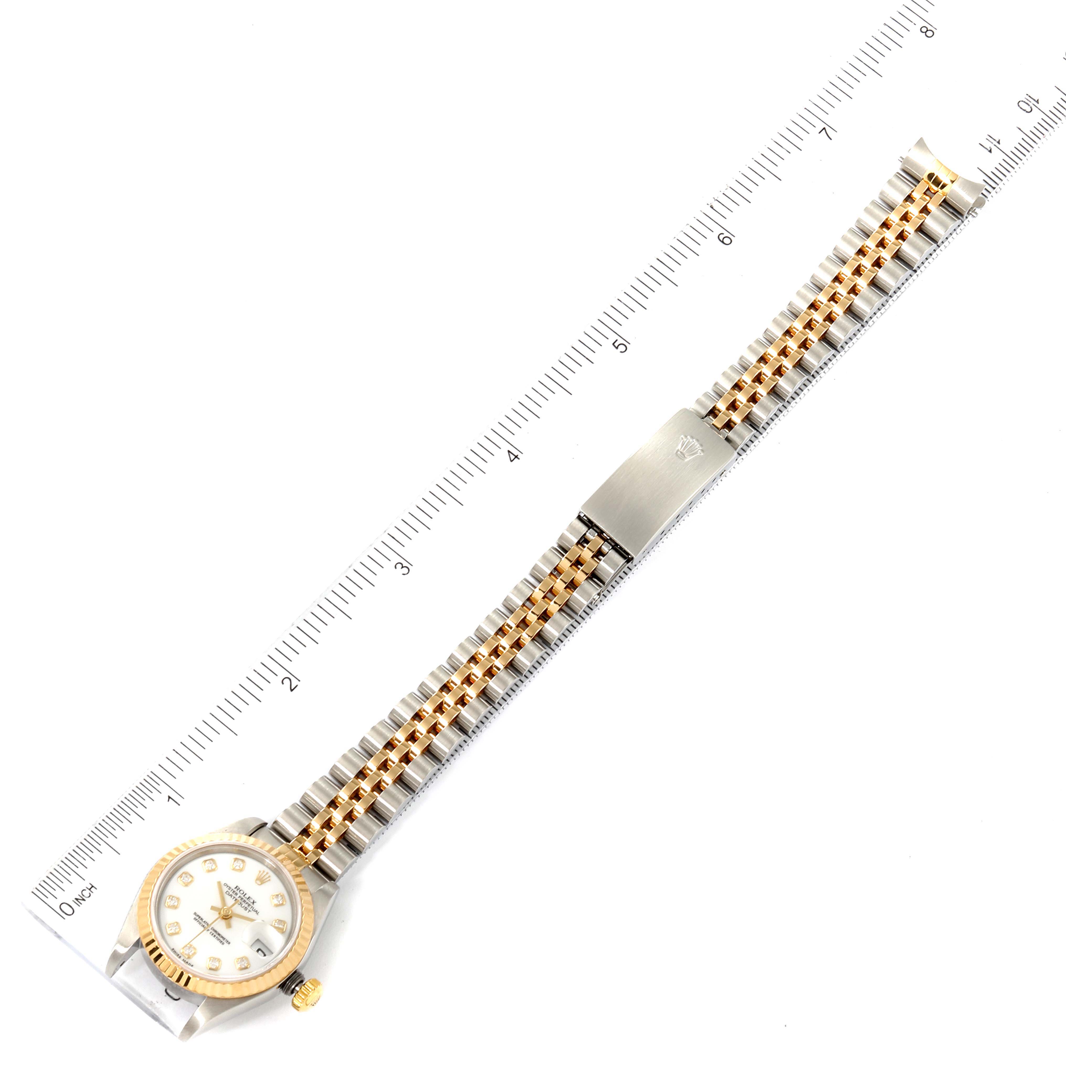 This image shows a top-down view of the Rolex Datejust 79173 Women's Steel and Gold (two tone) White Dial 79173 Women's Steel and Gold (two tone) White Dial watch, highlighting the face, two-tone bracelet, and clasp.