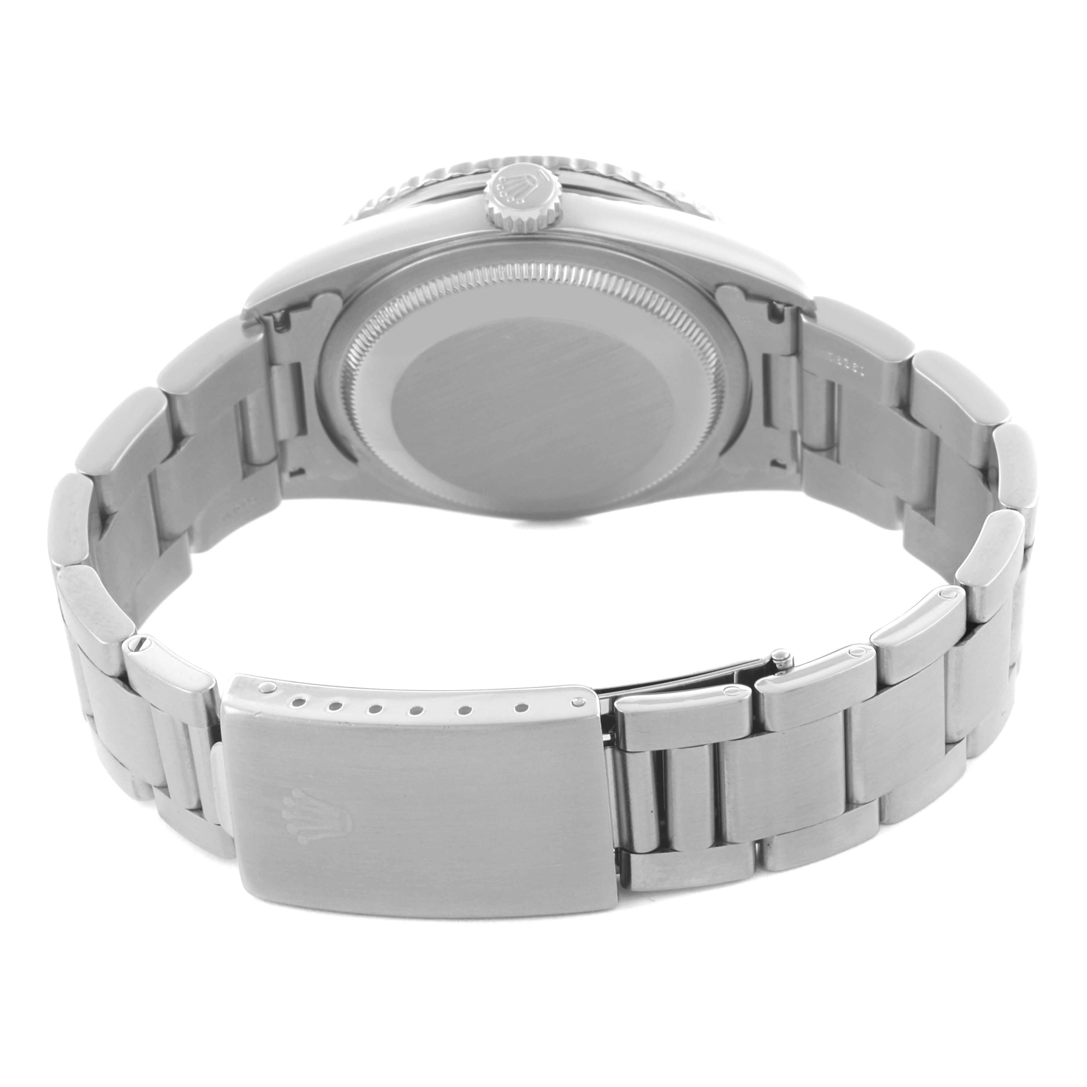 The Rolex Datejust watch is shown from the back, highlighting the clasp, bracelet, and caseback.