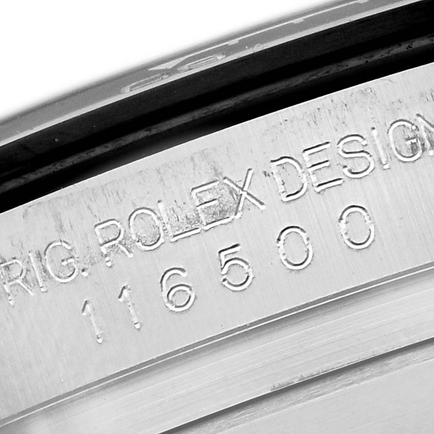 The image shows a close-up of the engraved serial number and "ROLEX DESIGN" on the side of the Rolex Daytona 116500LN Men's Stainless Steel White Dial 116500LN Men's Stainless Steel White Dial case.