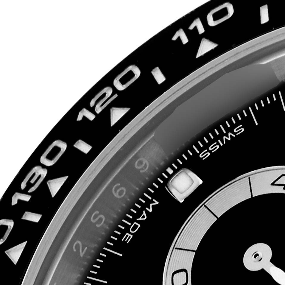 The image shows a close-up of the bezel and part of the dial of a Rolex Daytona 116500LN Men's Stainless Steel Black Dial 116500LN Men's Stainless Steel Black Dial, highlighting the tachymetric scale and sub-dials.