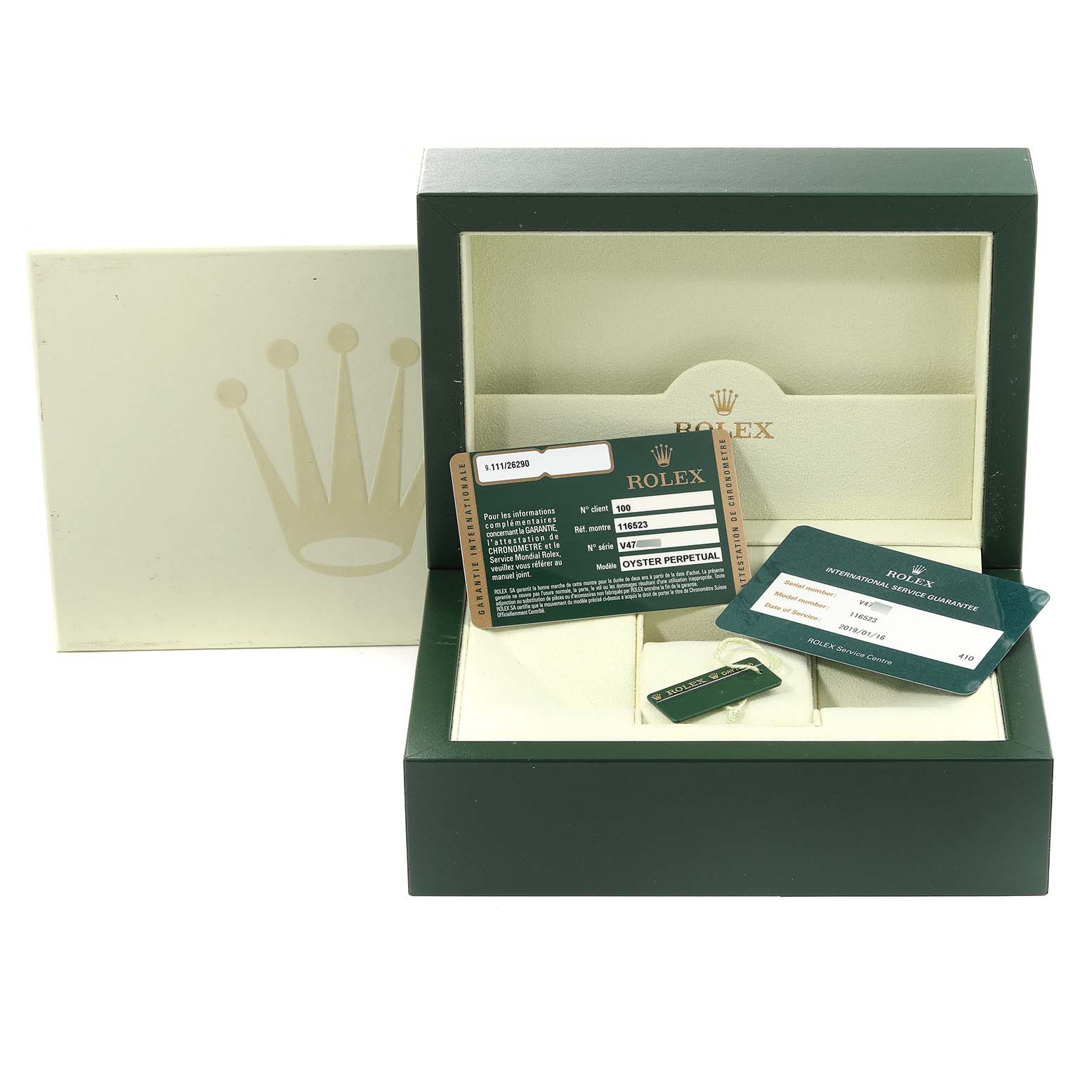 The image shows a Rolex Daytona 116523 Men's Steel and Gold (two tone) Silver Dial 116523 Men's Steel and Gold (two tone) Silver Dial watch box and accompanying warranty cards and tags from a front angle.