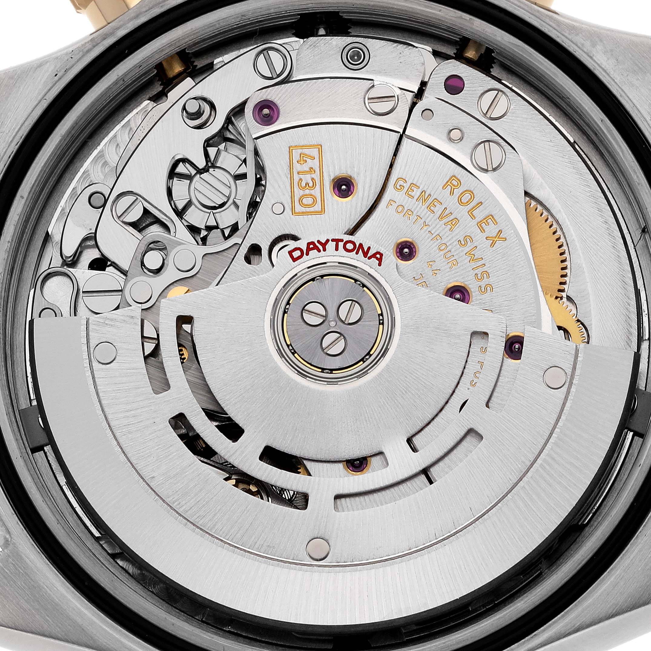 This image shows a close-up view of the Rolex Daytona 116523 Men's Steel and Gold (two tone) Silver Dial 116523 Men's Steel and Gold (two tone) Silver Dial watch's movement, revealing intricate inner parts and mechanisms.