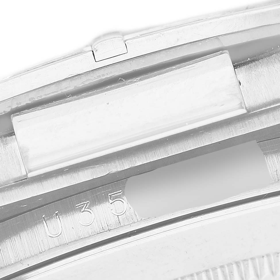 The image shows a close-up of the side view of a Rolex Daytona 16589 Men's White Gold Mother of Pearl Dial, highlighting the engraved serial number area.