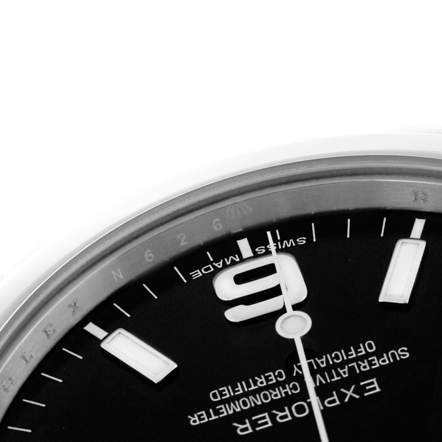 The image shows an angled close-up of the dial of a Rolex Explorer 214270 Men's Stainless Steel Black Dial 214270 Men's Stainless Steel Black Dial, featuring part of the chapter ring and hour markers.