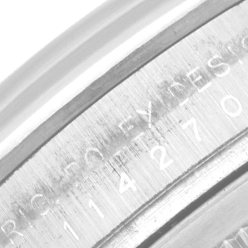 This close-up image shows the inner bezel with engraved details on the Rolex Explorer 114270 Men
s Stainless Steel Black Dial 114270 Men
s Stainless Steel Black Dial model.