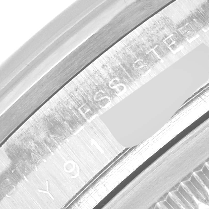 This close-up image shows the engravings on the case of the Rolex Explorer 114270 Men
s Stainless Steel Black Dial 114270 Men
s Stainless Steel Black Dial model watch.