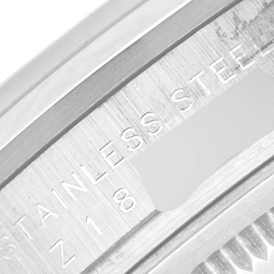 This is a close-up angled view of the underside bezel engraving on a Rolex Explorer 114270 Men
s Stainless Steel Black Dial 114270 Men
s Stainless Steel Black Dial watch, showing "STAINLESS STEEL."